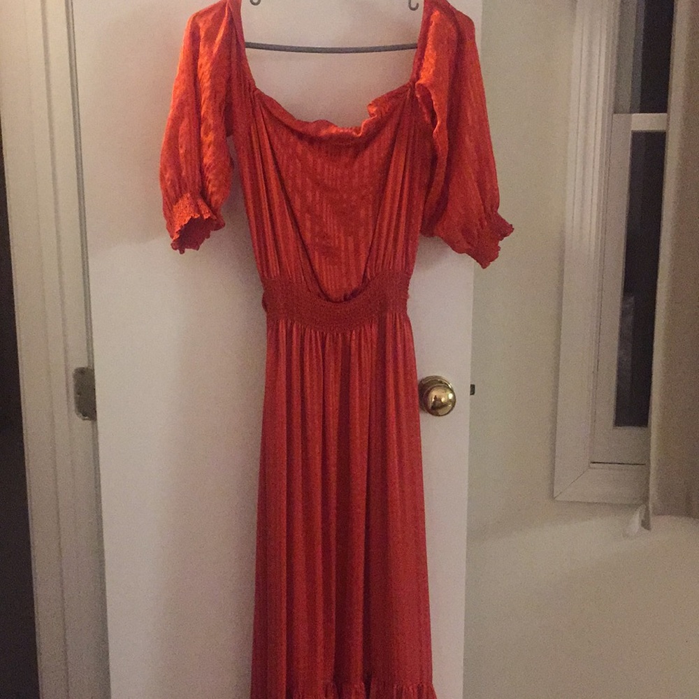 Calypso Pumpkin orange Grecian style silk dress.